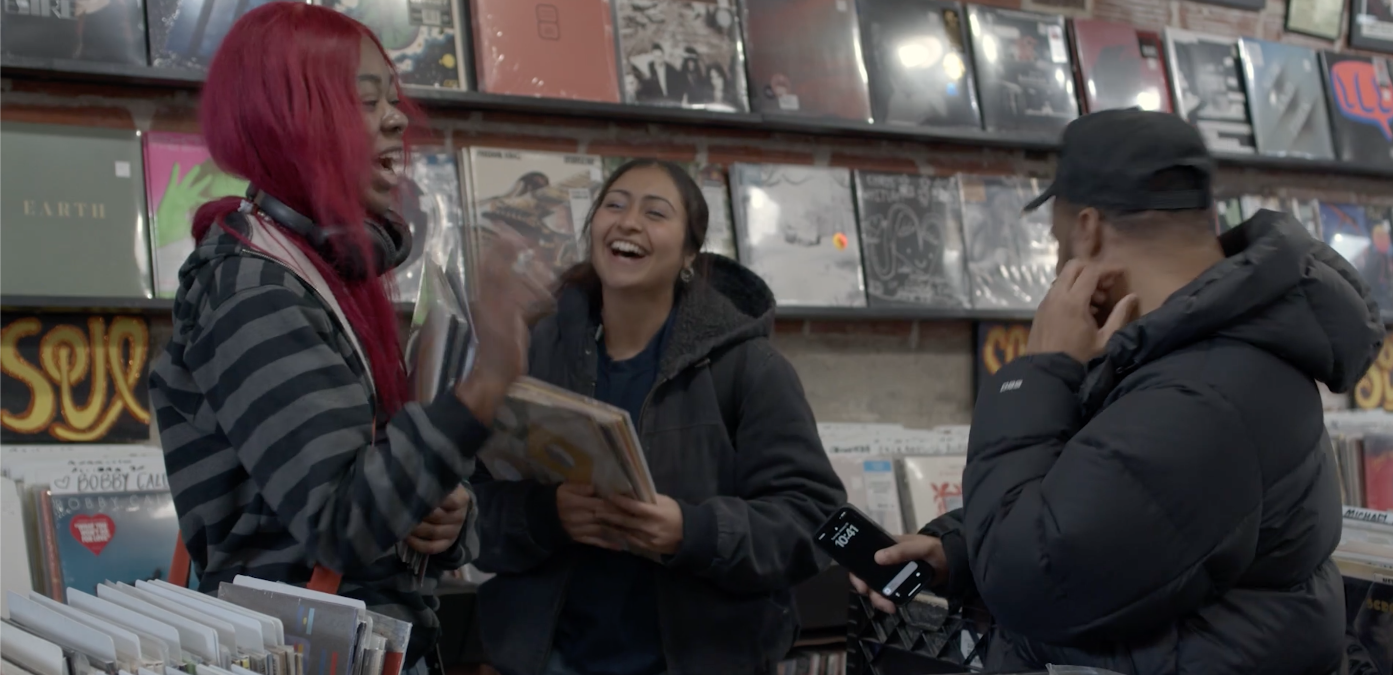 Two students laughing and talking